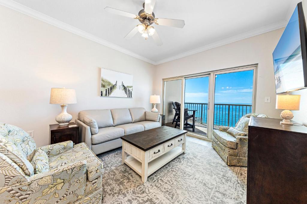 a living room with a couch and a table at Crystal Tower Unit 1508 in Gulf Shores