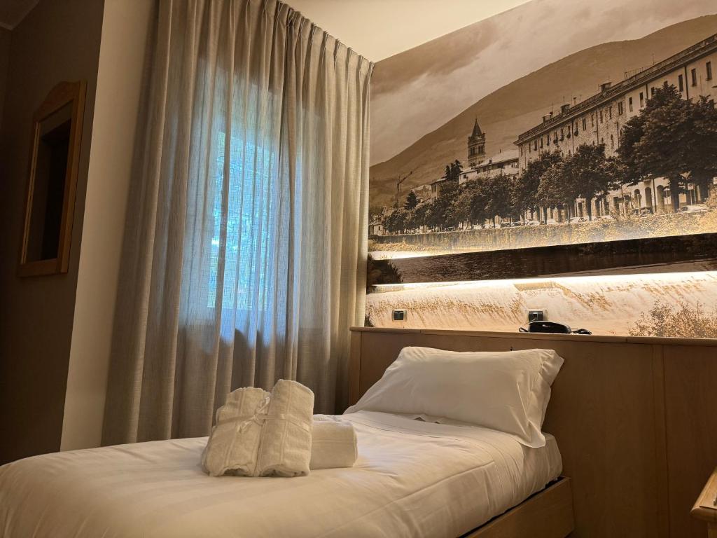 Postel nebo postele na pokoji v ubytování Hotel Cladan