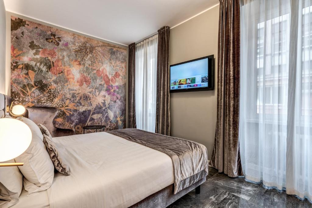 Postel nebo postele na pokoji v ubytování Apollo Boutique Hotel