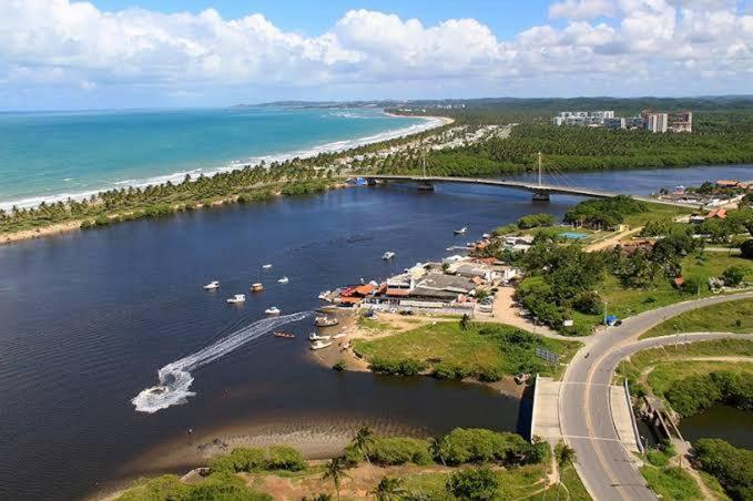 an aerial view of a river with boats in it at BUGAN PAIVA RECIFE in Recife
