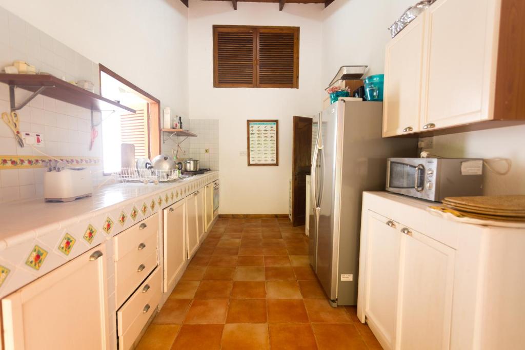 Kuchyň nebo kuchyňský kout v ubytování Coté Sud - Unique Villa & Bungalows Intendance Road