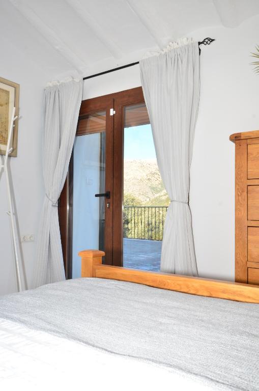 Postel nebo postele na pokoji v ubytování Cortijo Los Santeros