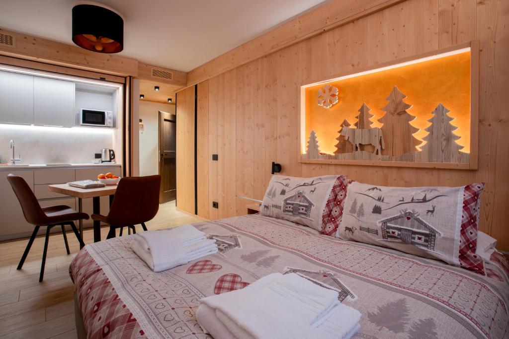 Rúm í herbergi á Chalet al Tabià