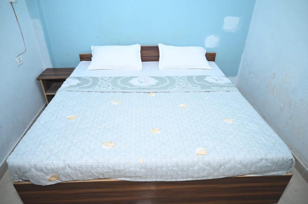 Postelja oz. postelje v sobi nastanitve Hotel Mahamaya Guest House Varanasi