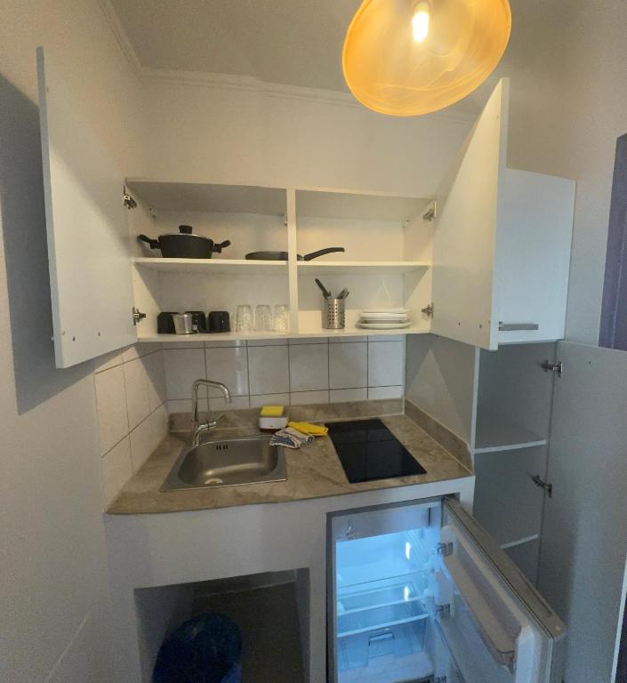 Kuchyň nebo kuchyňský kout v ubytování Comfort Hotel Apartments