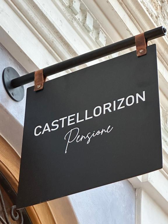 Castellorizon Pensione في ماغيستي: a sign that reads castelbourne prison hanging on a door