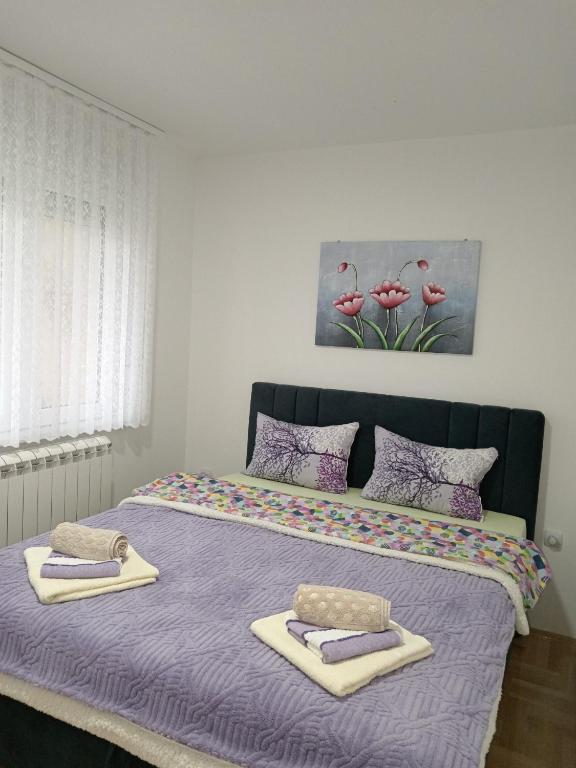 Postel nebo postele na pokoji v ubytování Apartman LARA