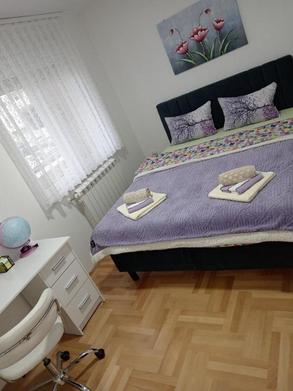 Postel nebo postele na pokoji v ubytování Apartman LARA