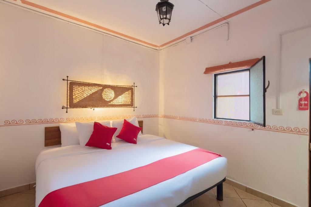 Postel nebo postele na pokoji v ubytování Hotel Coyopolan