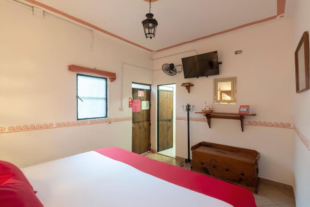 Postel nebo postele na pokoji v ubytování Hotel Coyopolan