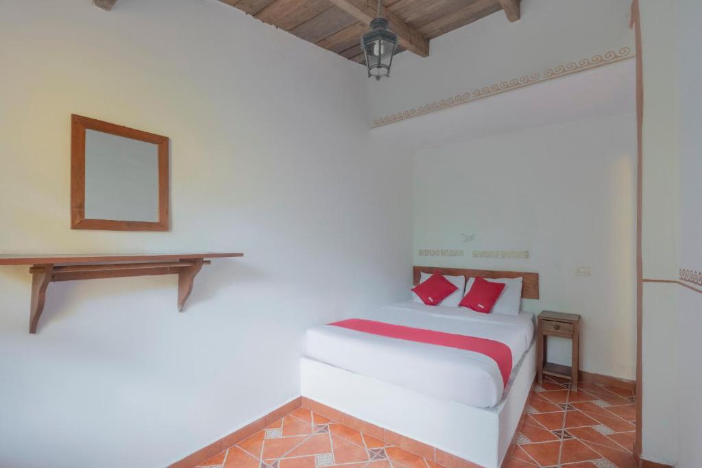 Postel nebo postele na pokoji v ubytování Hotel Coyopolan