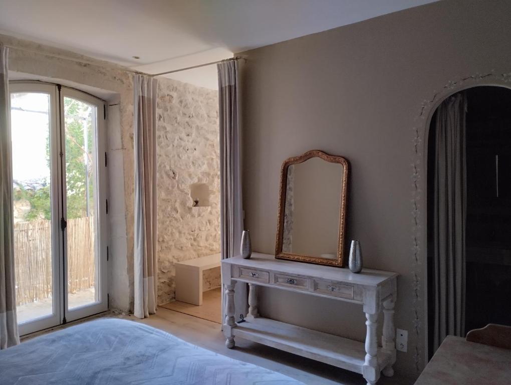 Postel nebo postele na pokoji v ubytování LE PATIO