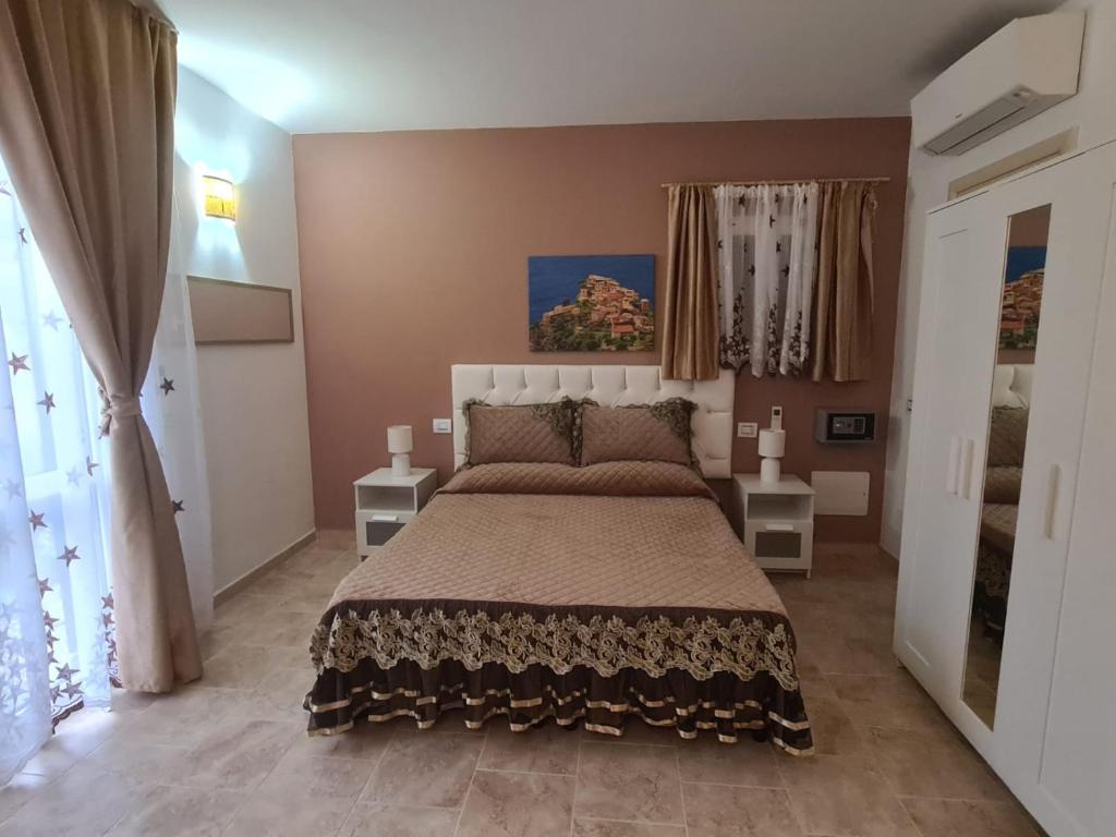 Postel nebo postele na pokoji v ubytování Agriturismo La Collina Verde