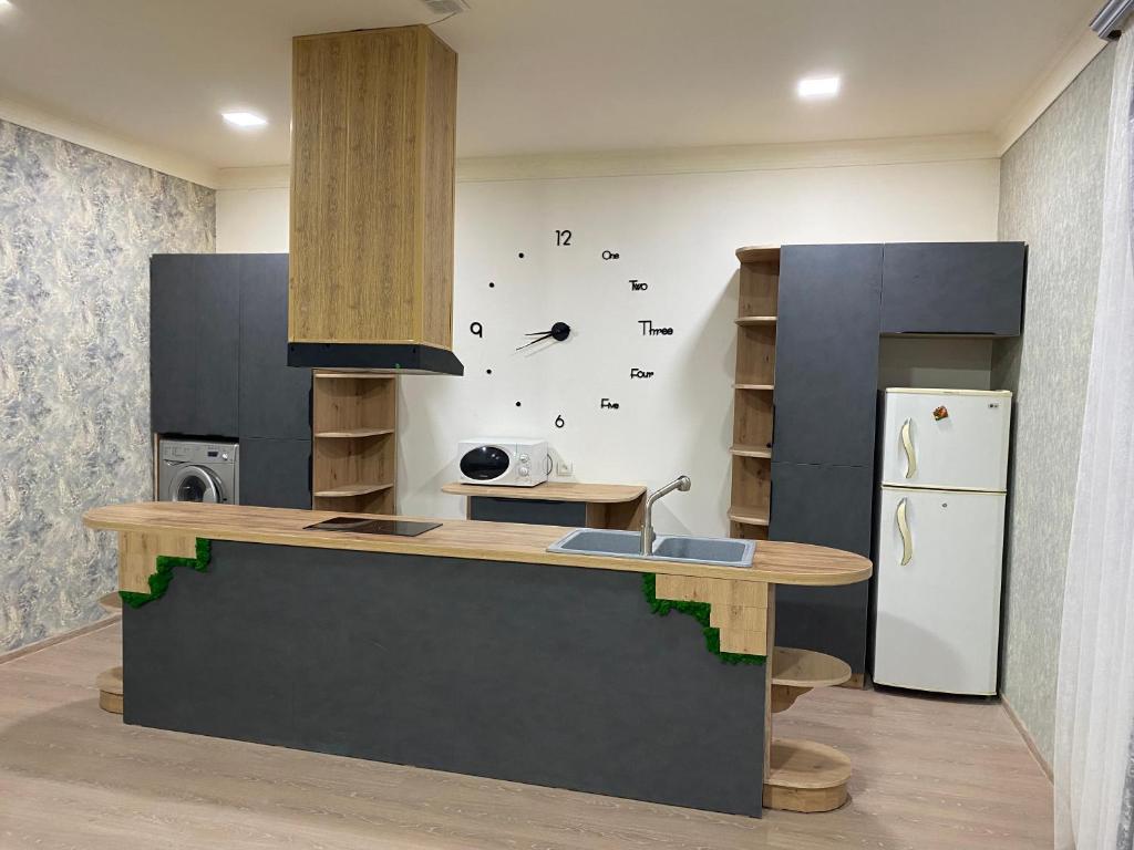a kitchen with a counter and a refrigerator at For the best in Sevan