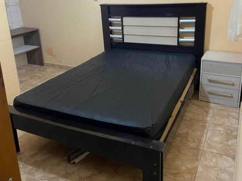 Ένα ή περισσότερα κρεβάτια σε δωμάτιο στο Aluga-se casa com piscina