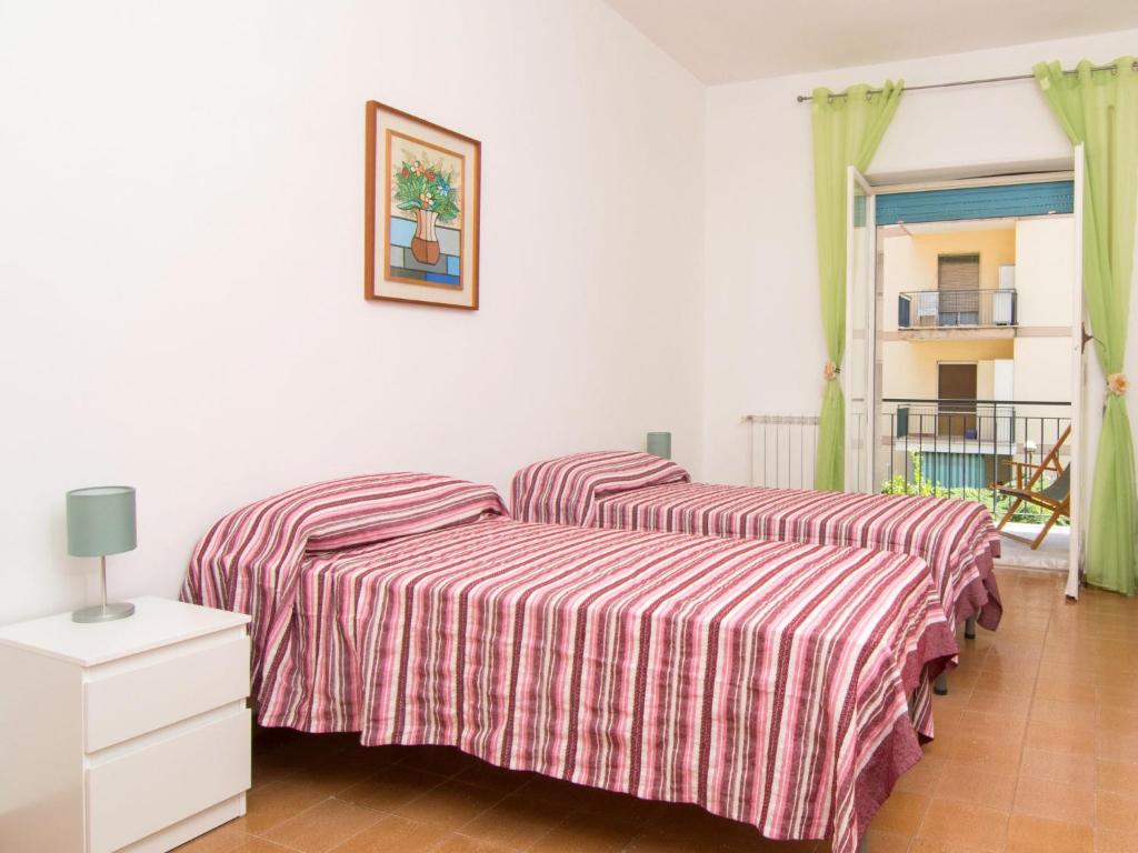 Łóżko lub łóżka w pokoju w obiekcie Apartment Ritamar by Interhome