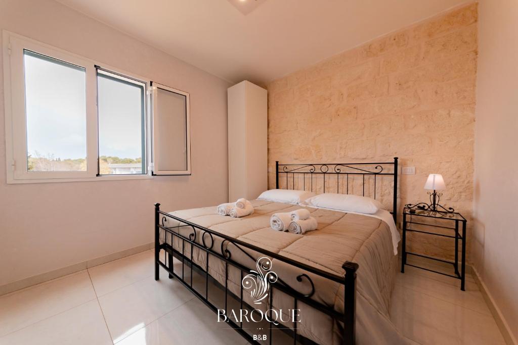 Postel nebo postele na pokoji v ubytování Baroque B&B