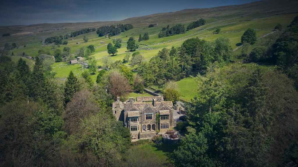 an aerial view of a large house in a field at Oughtershaw Hall in Skipton