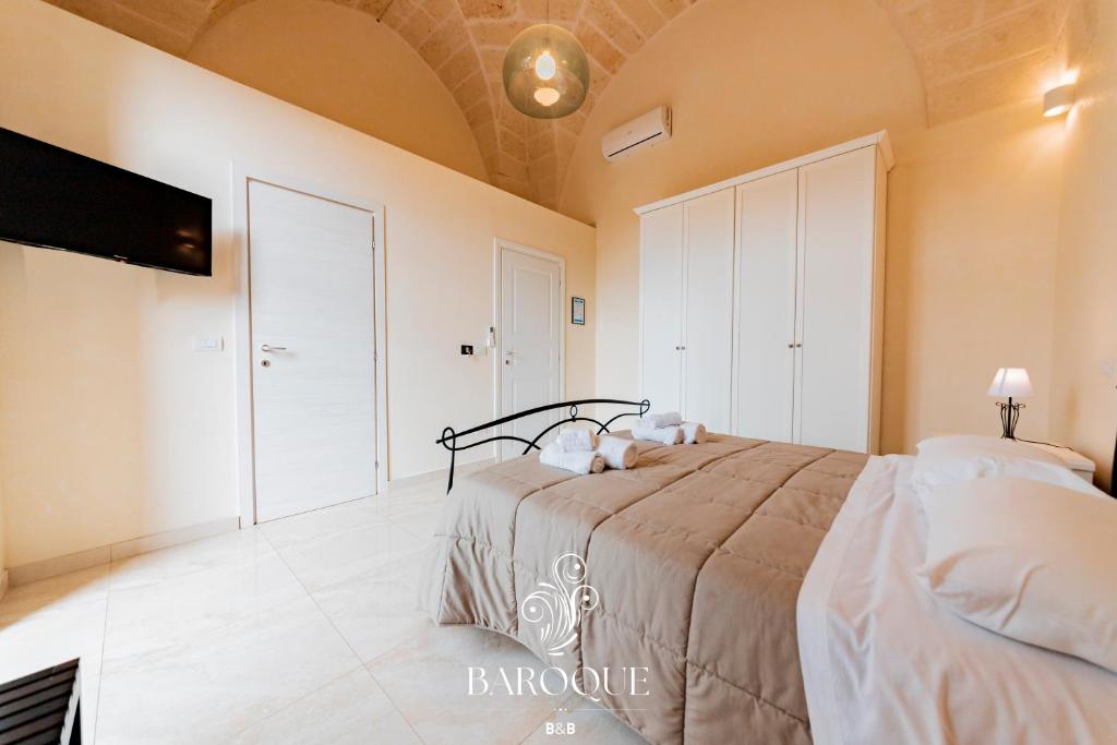 Postel nebo postele na pokoji v ubytování Baroque B&B