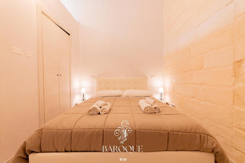 Postel nebo postele na pokoji v ubytování Baroque B&B