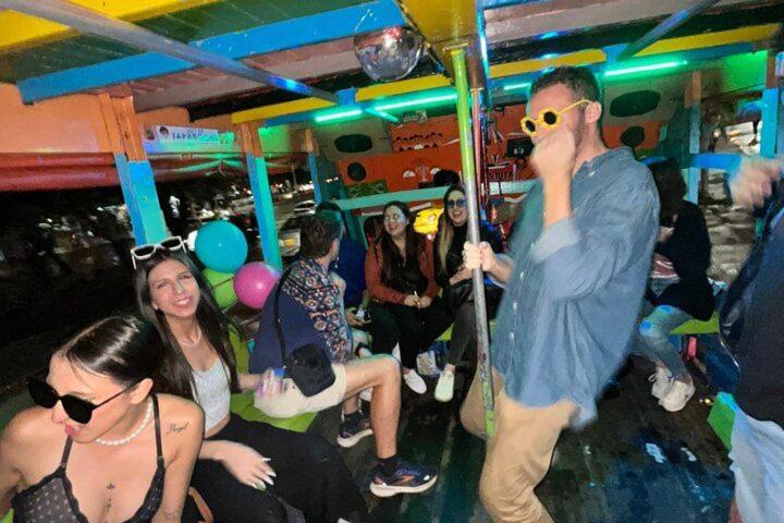 a group of people on a party bus at Las Aguas Social Experience in Bogotá