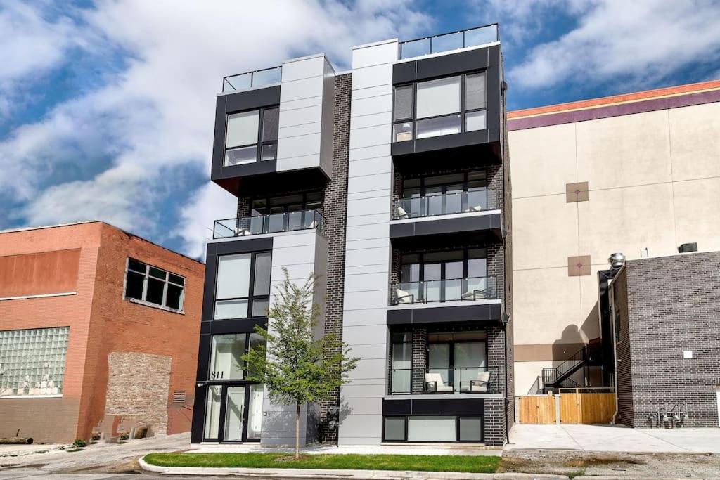 a black and white apartment building at New Construction Building in River North in Chicago