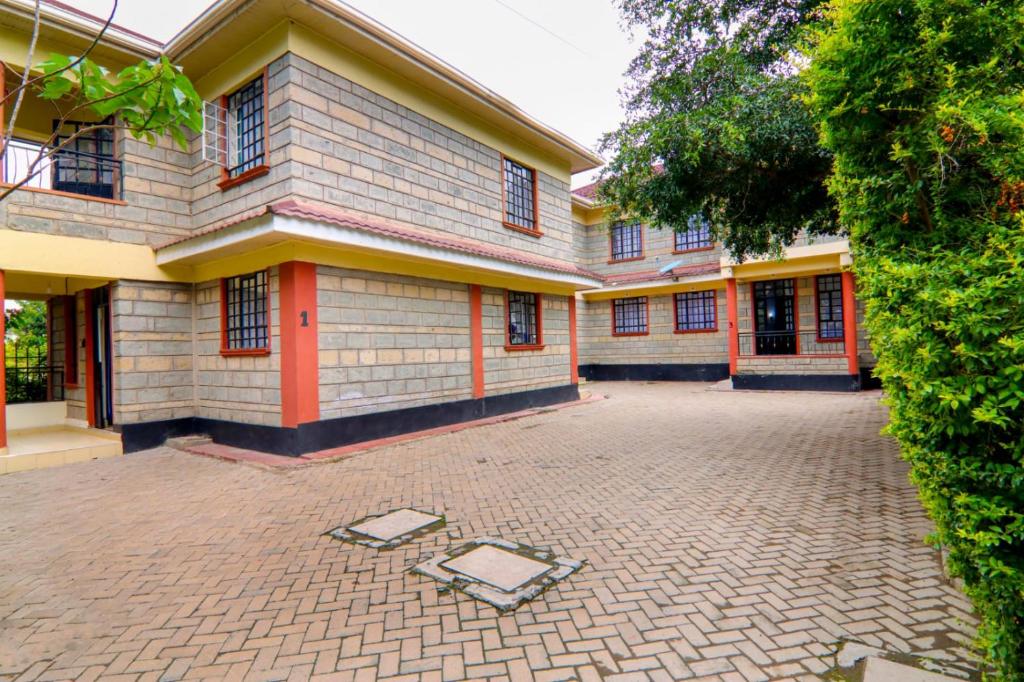 an empty courtyard in front of a building at FOREVER 3 RESIDENCE in Naivasha