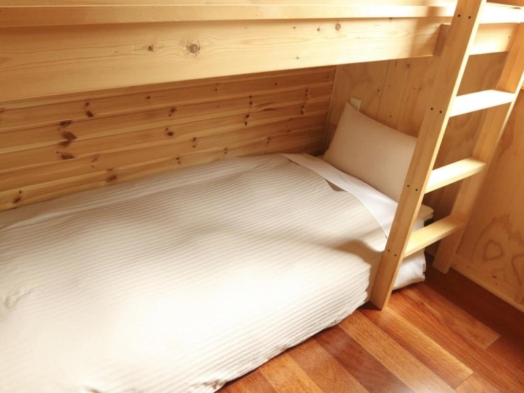 En eller flere senge i et værelse på Phottage inn Biei - Vacation STAY 20955v