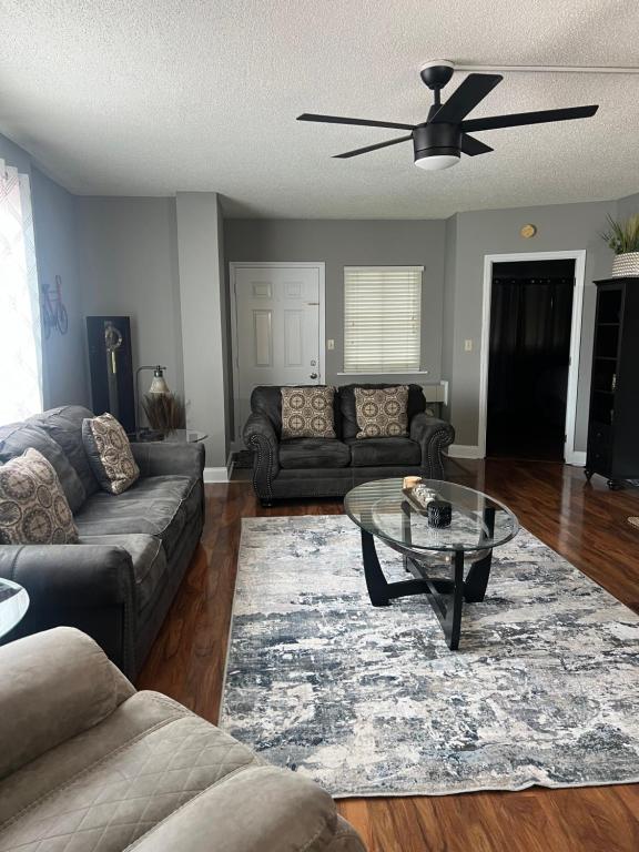 a living room with a couch and a table at River Place Condos #501 2BD in Pigeon Forge