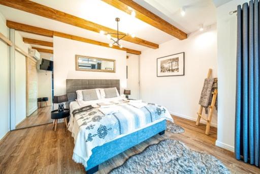 Posteľ alebo postele v izbe v ubytovaní Apartament Kamieniec