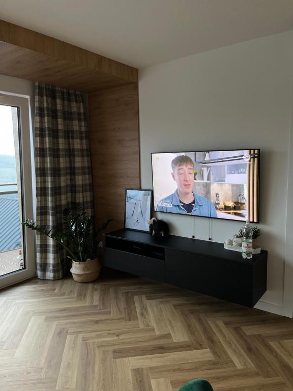 TV a/nebo společenská místnost v ubytování Apartament Kamienna 28 z prywatną sauną