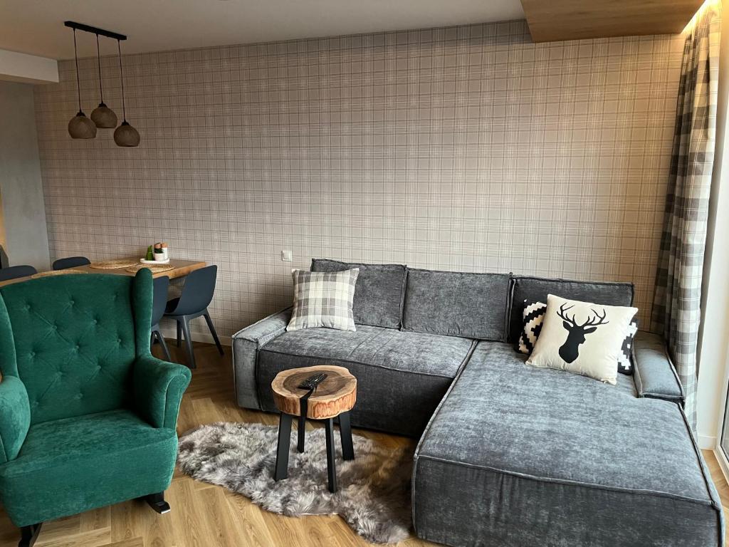 Posezení v ubytování Apartament Kamienna 28 z prywatną sauną