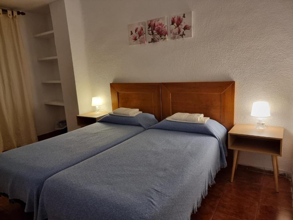 Cama o camas de una habitación en Casa de Huéspedes Cuenca