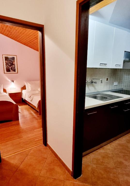 Postel nebo postele na pokoji v ubytování Nadija Rooms Funtana