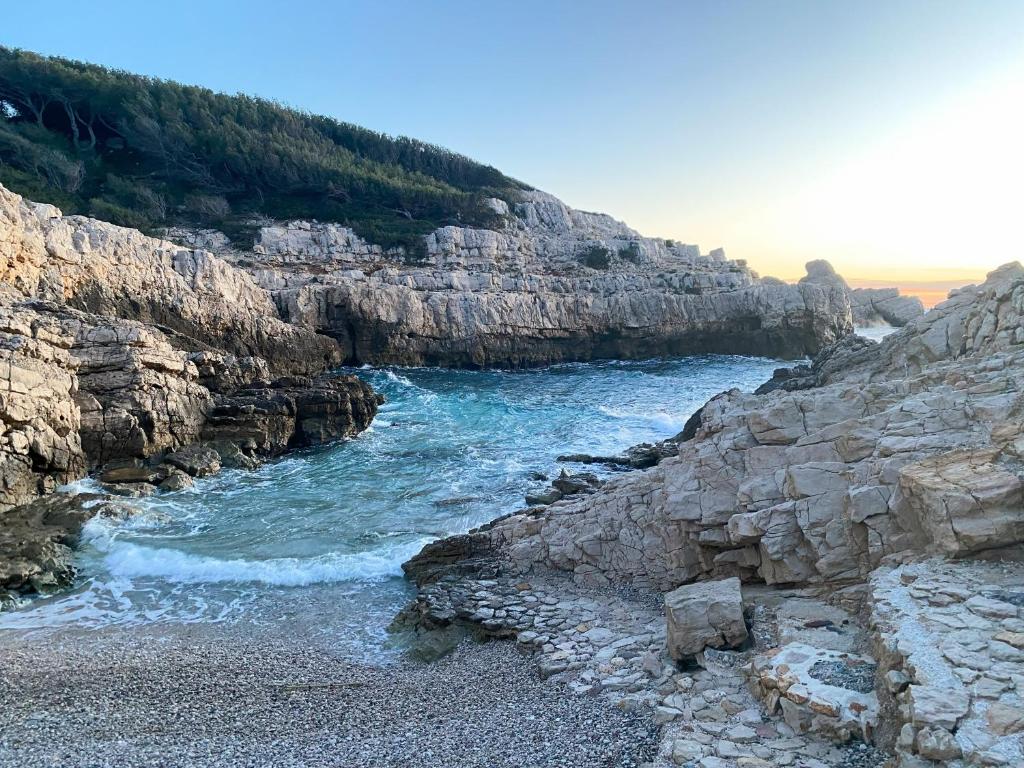 a view of a river from a rocky cliff at Villa d'exception piscine privée et vue mer in Saint-Cyr-sur-Mer
