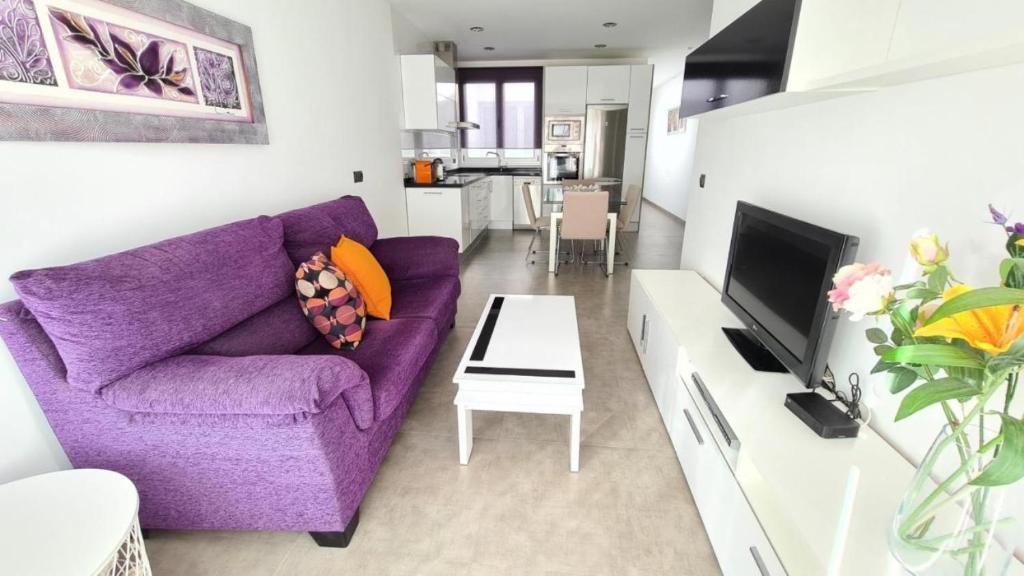 Televízia a/alebo spoločenská miestnosť v ubytovaní Apartment La Cruz 8 SilHouse