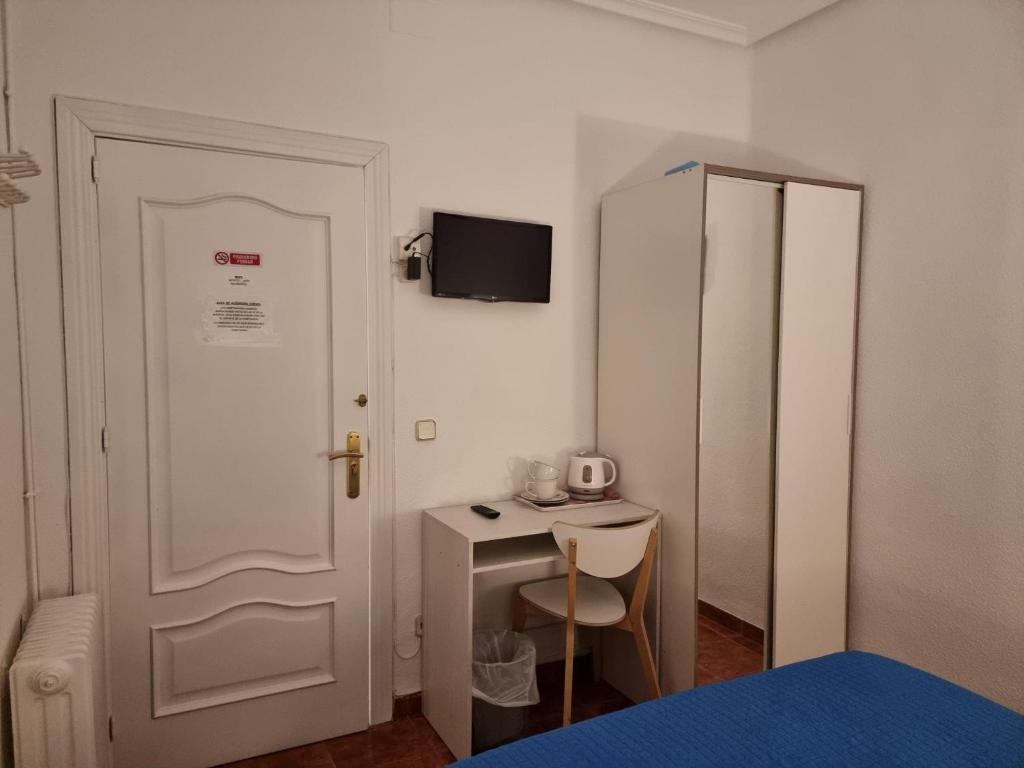 Cama o camas de una habitación en Casa de Huéspedes Cuenca