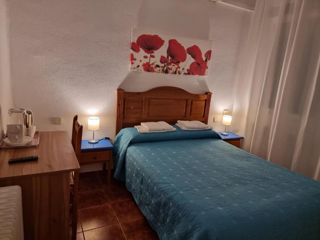Cama o camas de una habitación en Casa de Huéspedes Cuenca