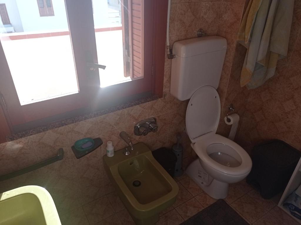 Ванная комната в Mansarda con terrazzo vista mare