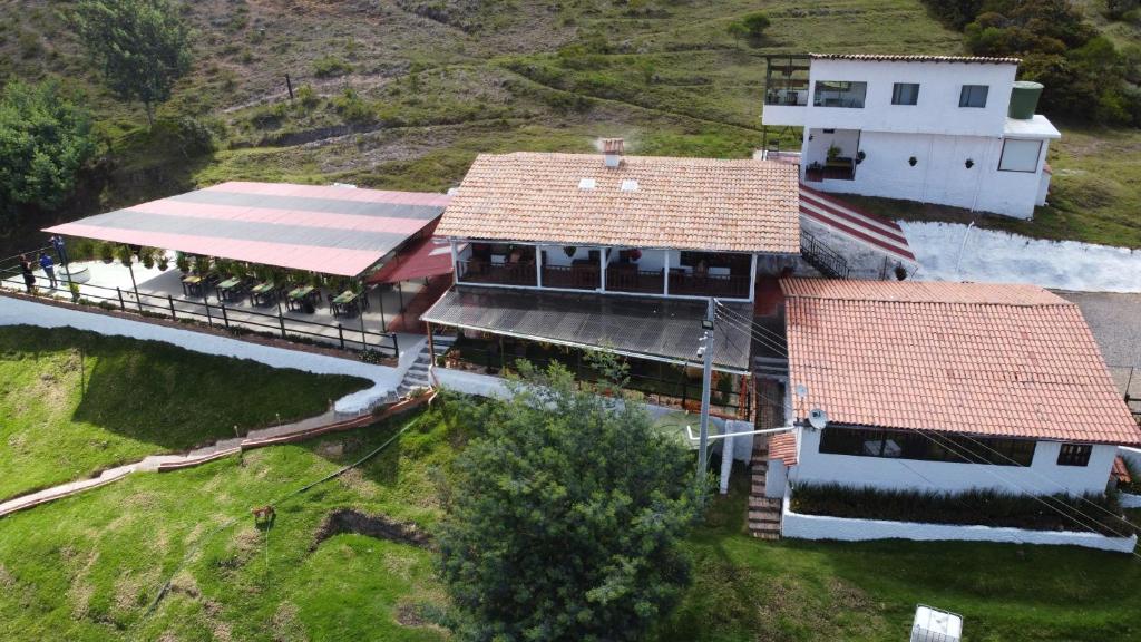 an aerial view of a house with a train station at Savieza Life Experience in Nemocón