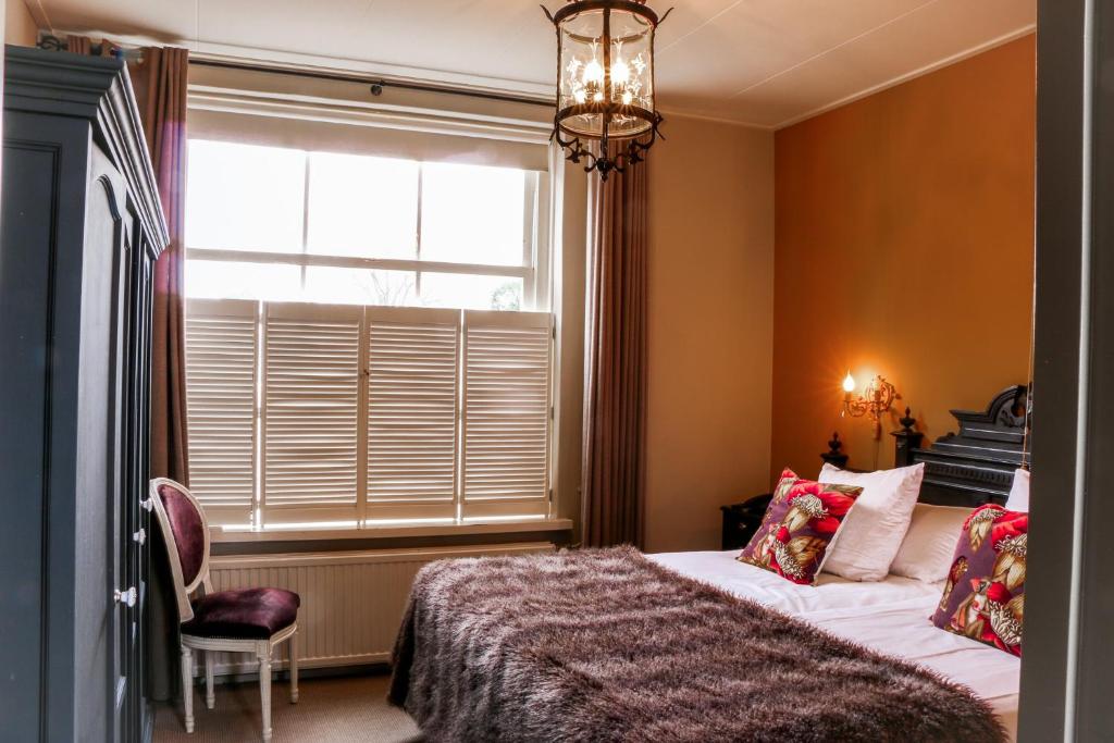 Postel nebo postele na pokoji v ubytování Auberge de Campveerse Toren