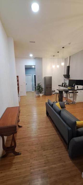 a living room with a couch and a table at "Habitaciones Confort La Cuesta" in Las Lagunas