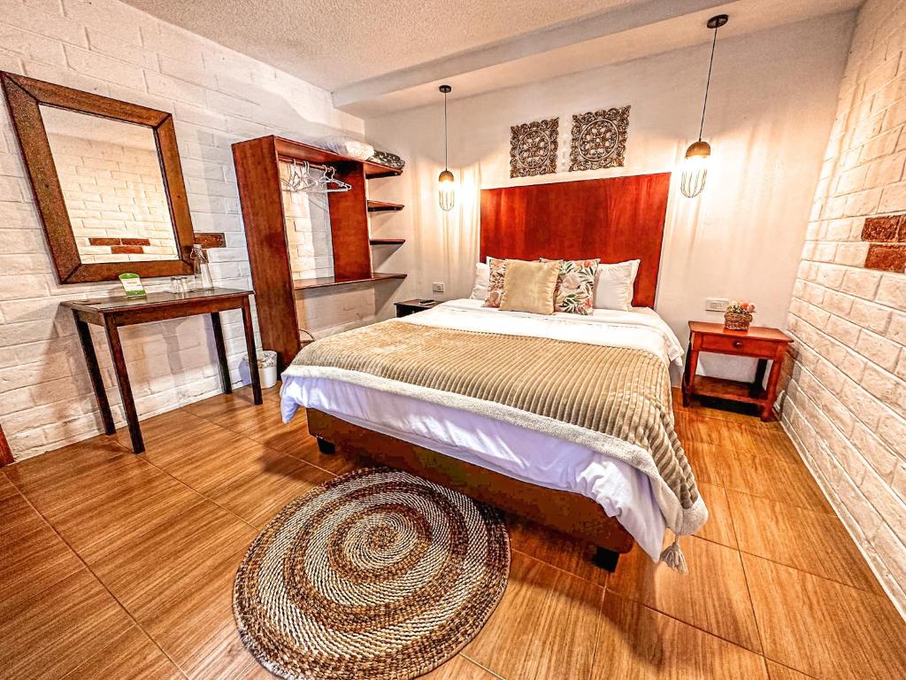 Postel nebo postele na pokoji v ubytování La Floresta Hotel