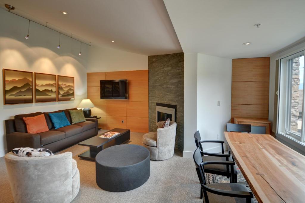 a living room with a couch and a table at Terracehouse - CoralTree Residence Collection in Snowmass Village