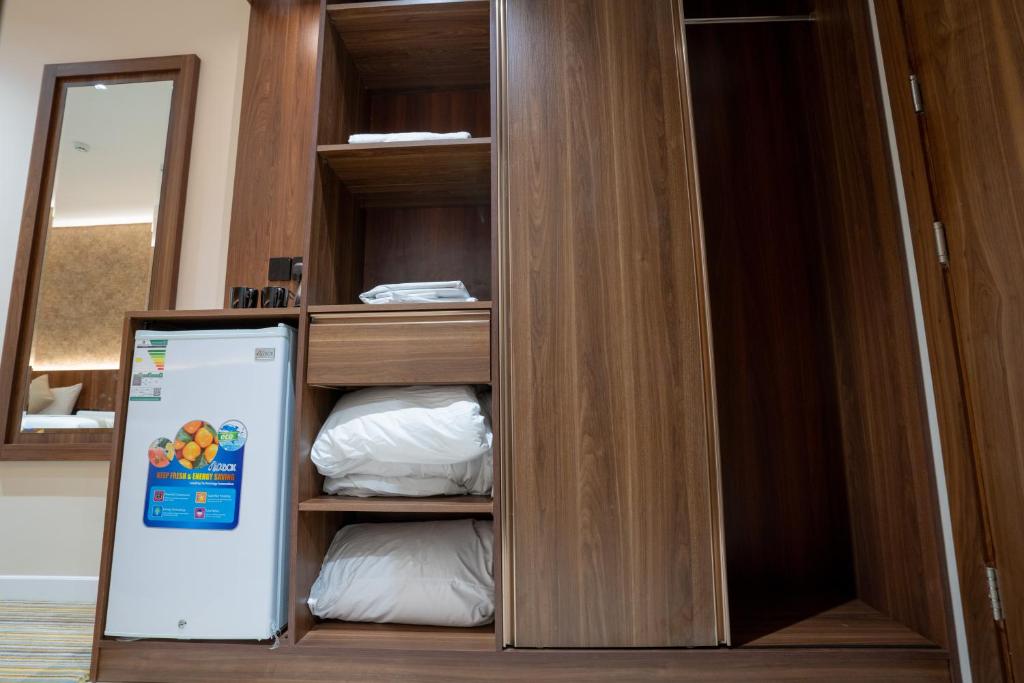 Postel nebo postele na pokoji v ubytování Rawha Al Maqam Ajyad Hotel