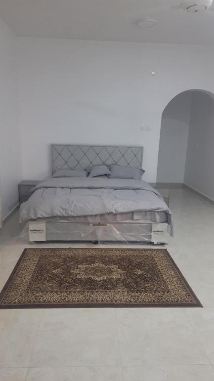Katil atau katil-katil dalam bilik di إستراحة المروج بالجبل الأخضر