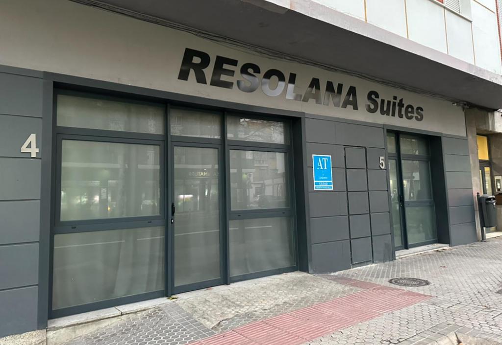 a building with the entrance to arescial ama suites at Resolana Suites in Seville
