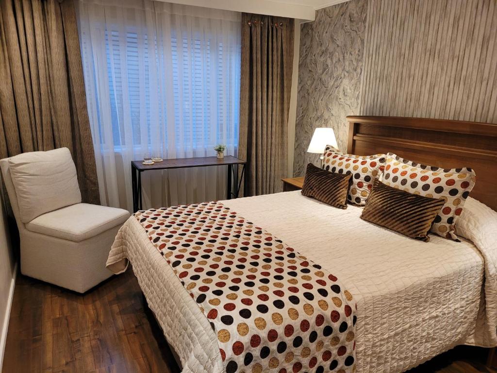 Postel nebo postele na pokoji v ubytování Hotel Puerta del Lago