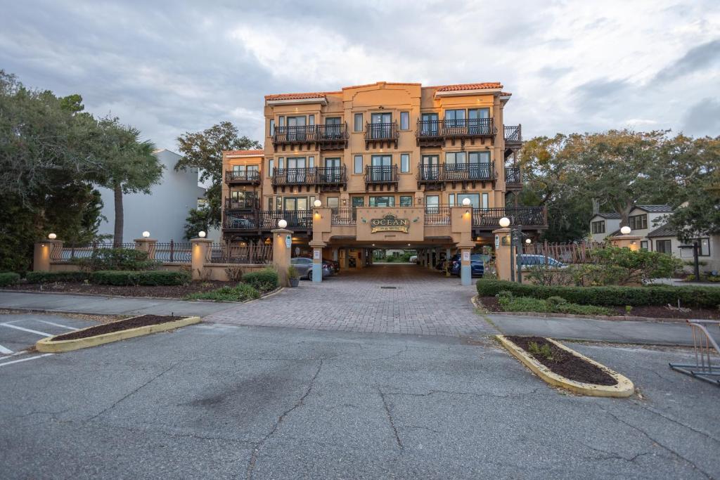 a large apartment building in the middle of a street at Ocean Inn & Suites in Saint Simons Island
