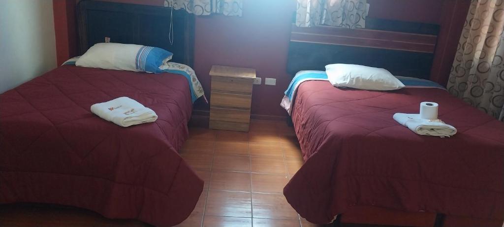 Postel nebo postele na pokoji v ubytování HOSTAL JOYA ANDINA